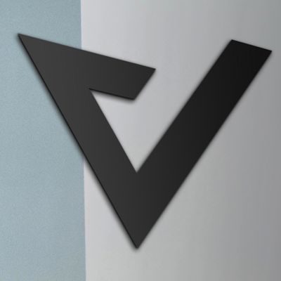 Capovario logo submark in black on an office wall