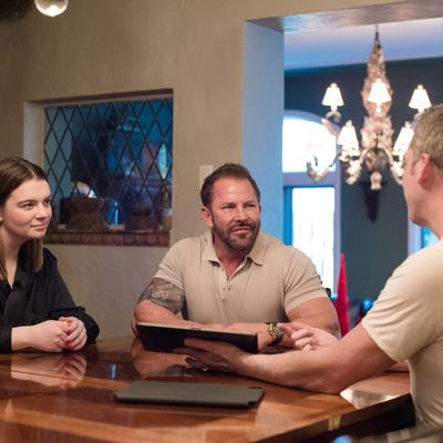 Dave Kersting, CEO, sitting with two clients at a table